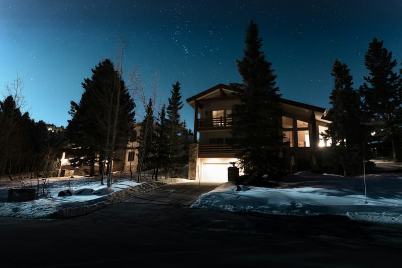 Craftsman home lit at dusk