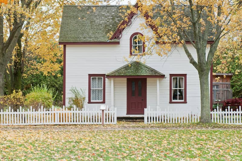 Historic farmhouse with a picket fence