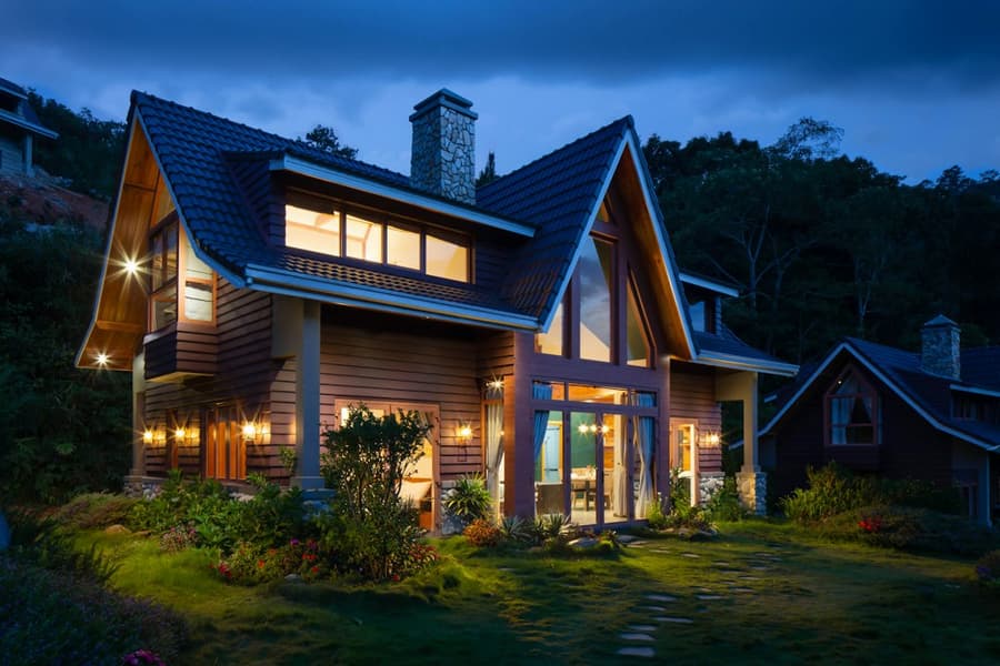 Gabled family home lit up at twilight