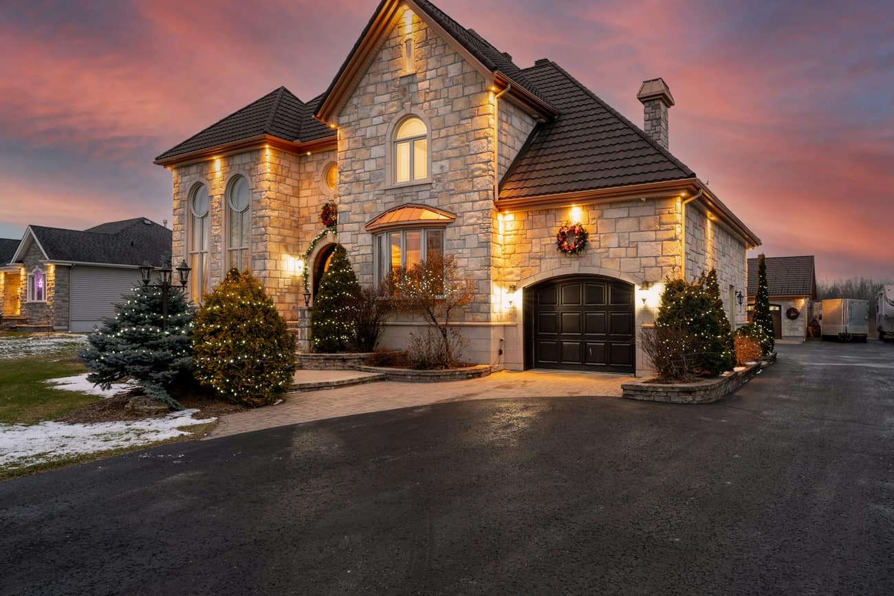 Stone home illuminated at dusk
