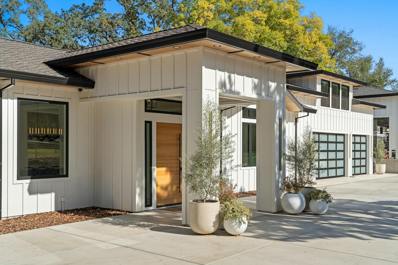 Modern farmhouse with glass garage doors