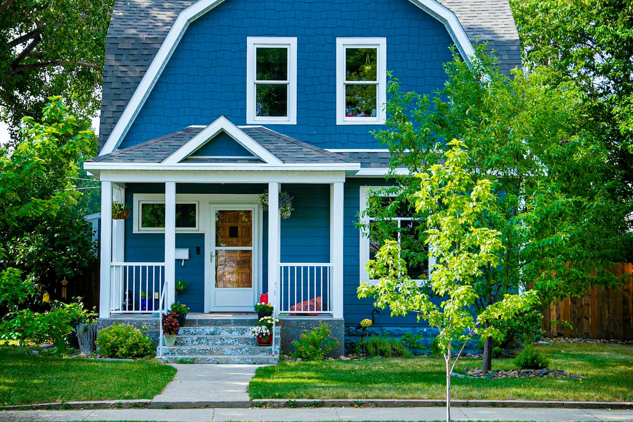 Blue craftsman home with a welcoming front porch