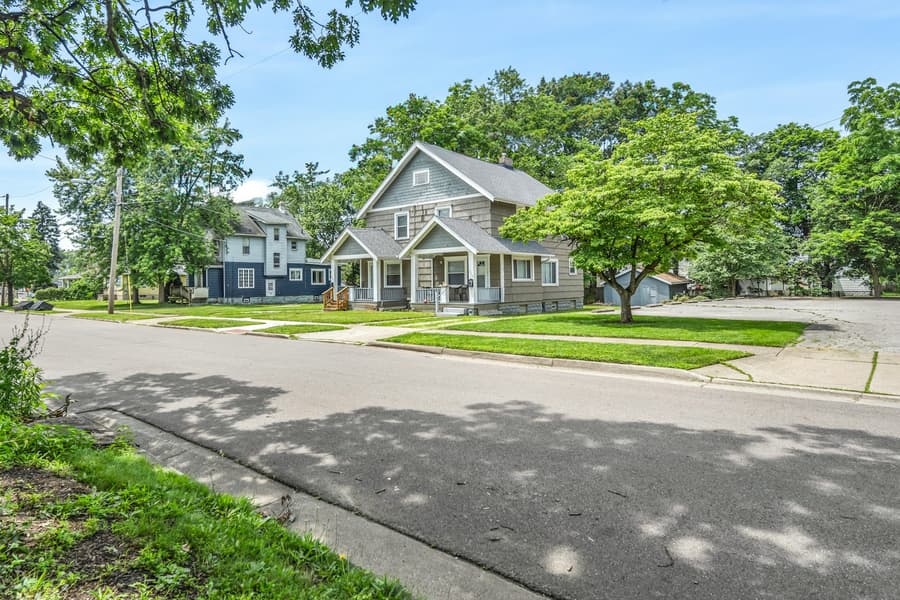Tree-lined street with a classic home